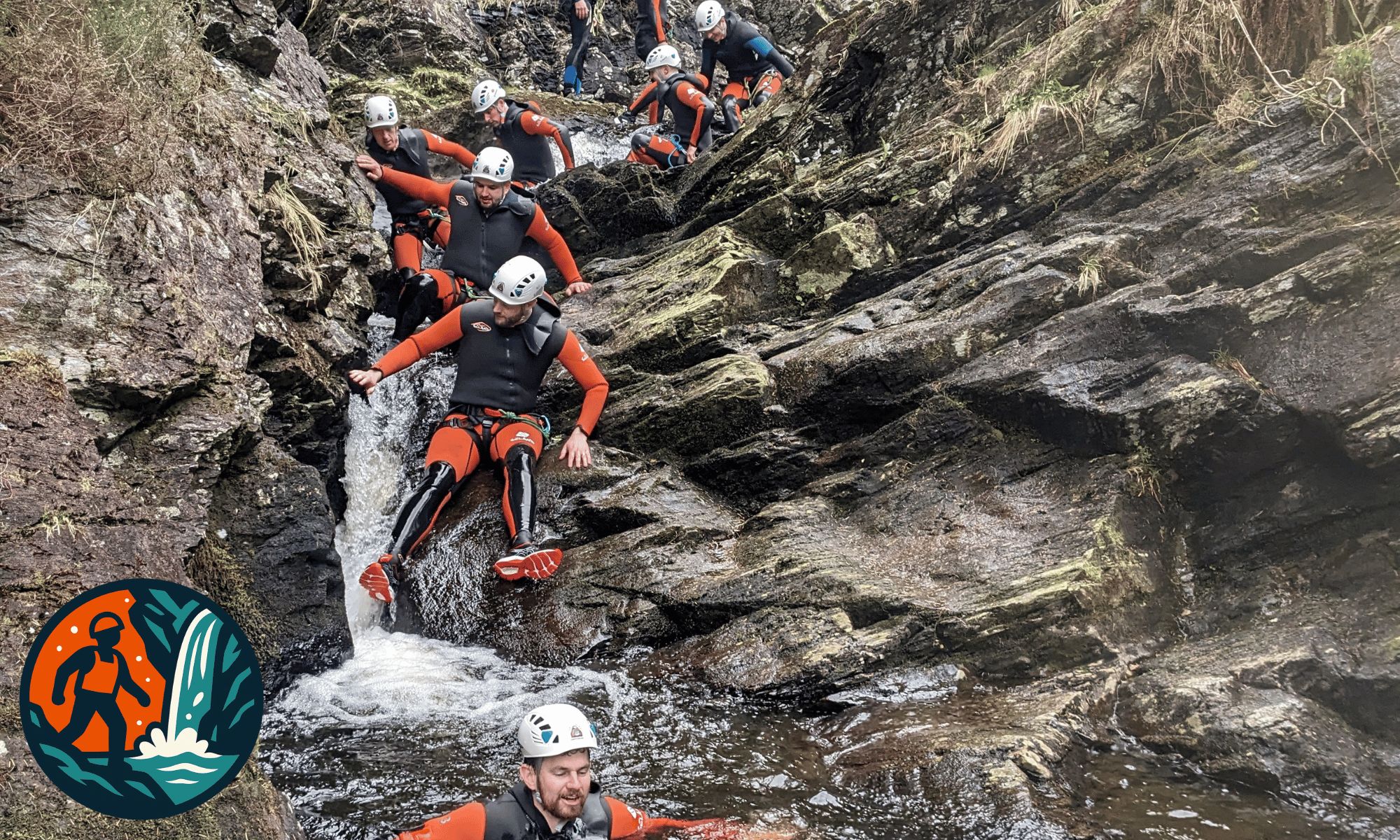 Group descending a gorge scramble in Galloway, Scotland